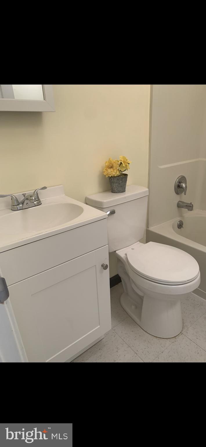 428 Croyden Road Upper Darby, PA 19082 - Photo 12 of 12 a bathroom with a toilet a sink and mirror