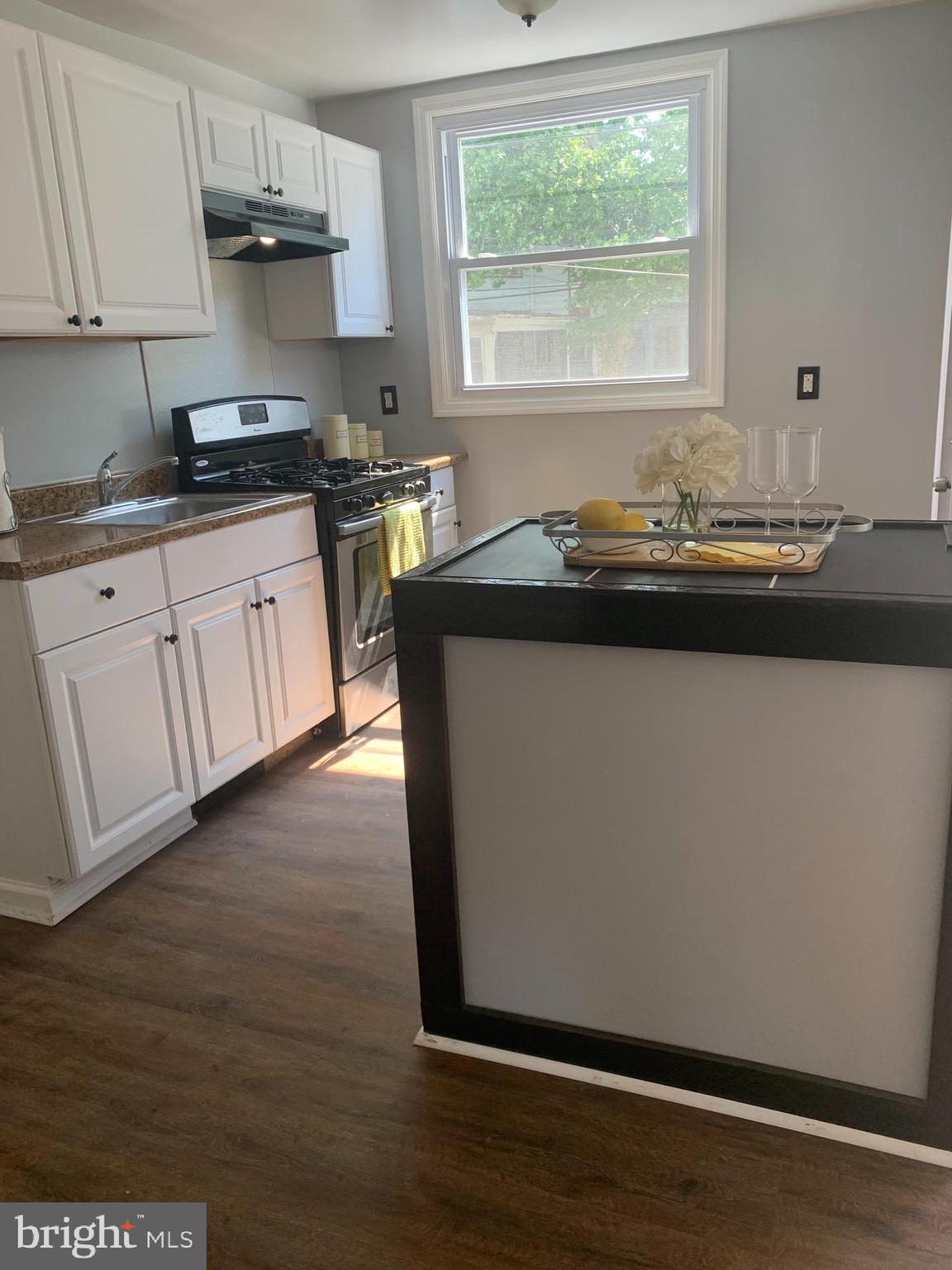 428 Croyden Road Upper Darby, PA 19082 - Photo 8 of 12 a kitchen with granite countertop a sink cabinets and wooden floor
