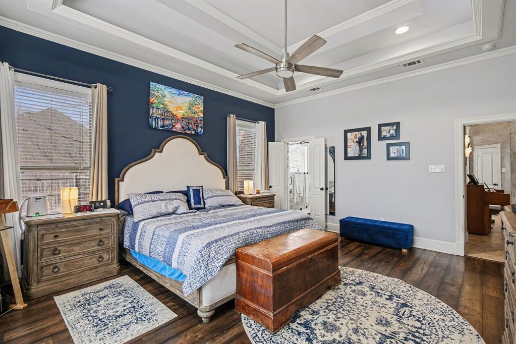 1361 Shallowbend Drive Midlothian, TX 76065 - Photo 16 of 30 a bedroom with a large bed a chandelier and dresser