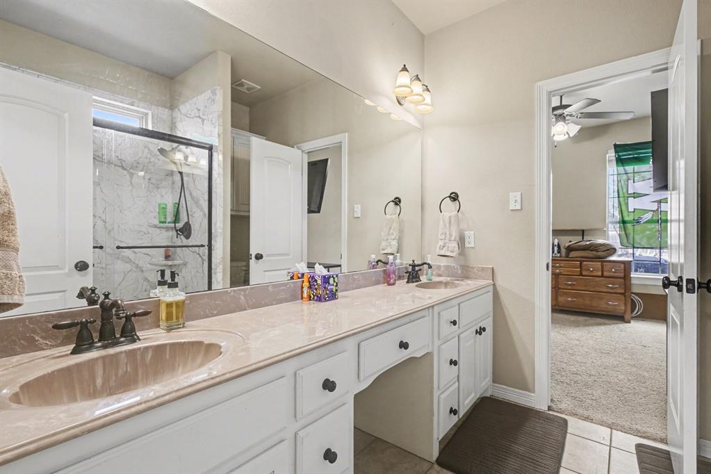 1361 Shallowbend Drive Midlothian, TX 76065 - Photo 20 of 30 a bathroom with double vanity sink a mirror and a shower