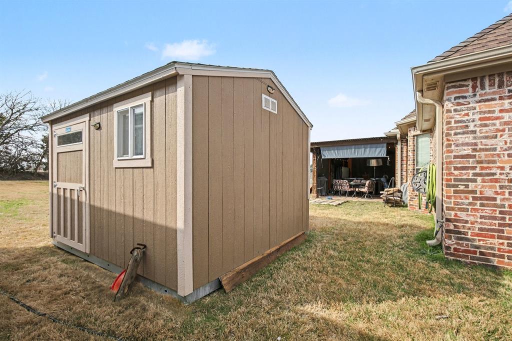 1361 Shallowbend Drive Midlothian, TX 76065 - Photo 26 of 30 a view of a house with backyard and sitting area
