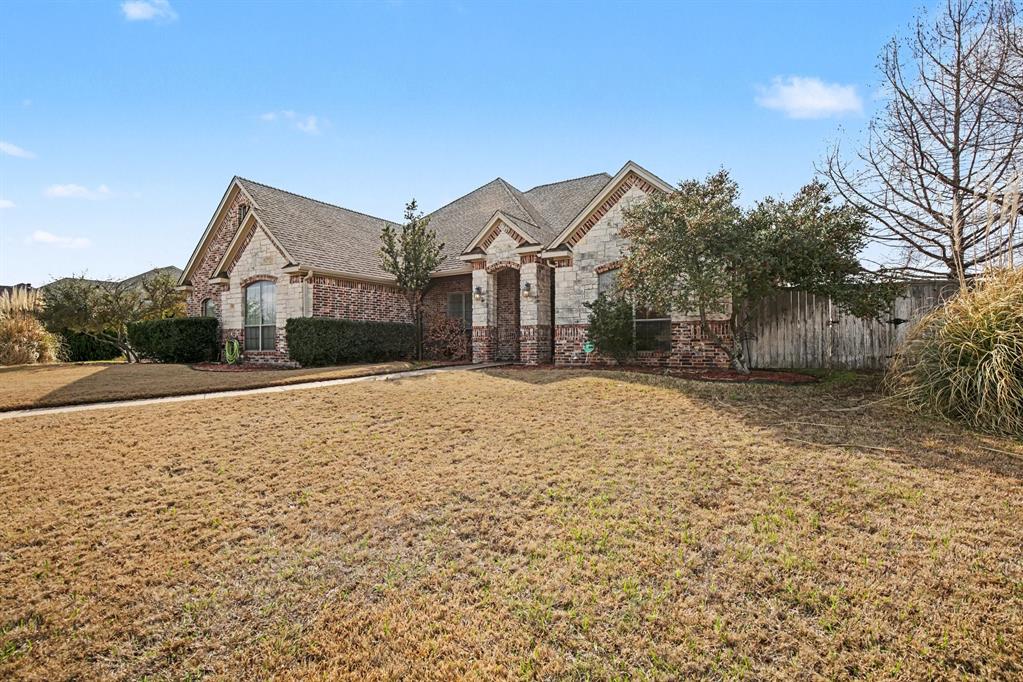 1361 Shallowbend Drive Midlothian, TX 76065 - Photo 3 of 30 a front view of a house with a yard and garage