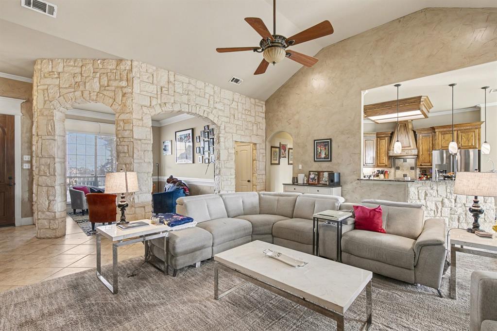 1361 Shallowbend Drive Midlothian, TX 76065 - Photo 7 of 30 a living room with furniture or couches and a dining table with wooden floor