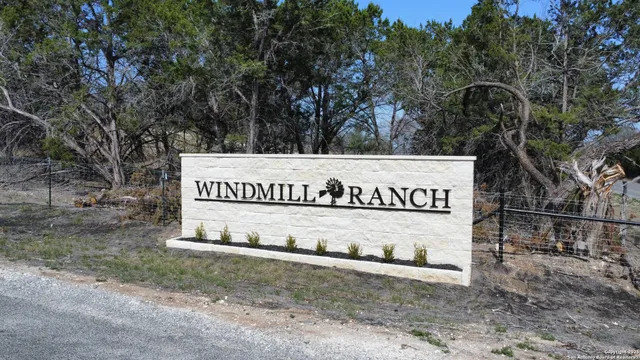 a view of outdoor space with signage and flags