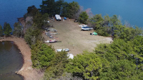 an aerial view of a house with a yard