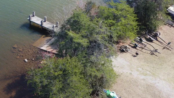 a view of a lake with outdoor seating