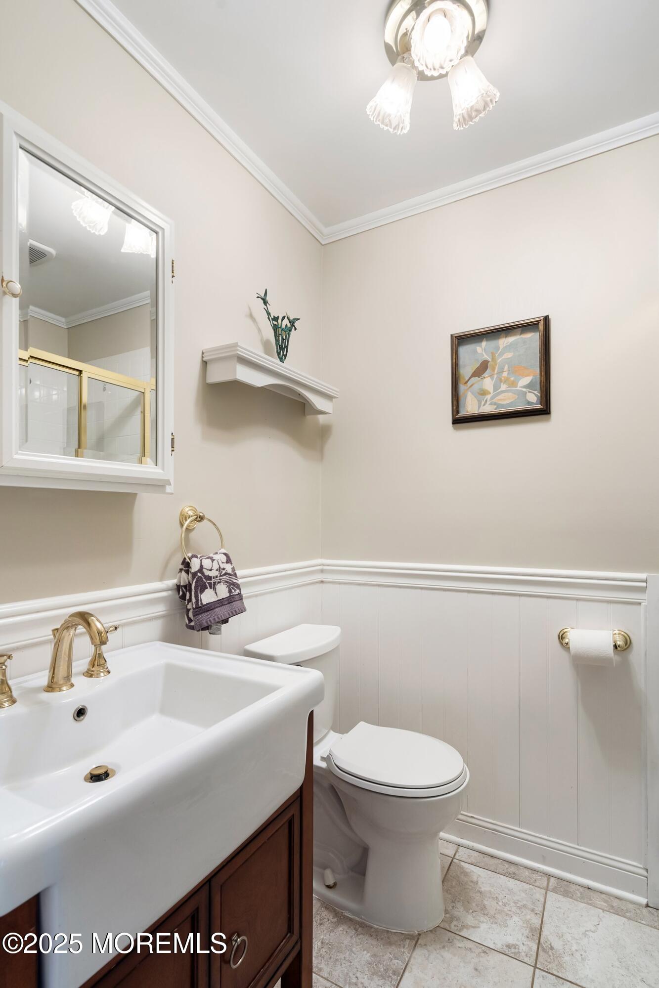 7 Spring Lake Avenue Oceanport, NJ 07757 - Photo 20 of 44 a bathroom with a toilet a sink and mirror