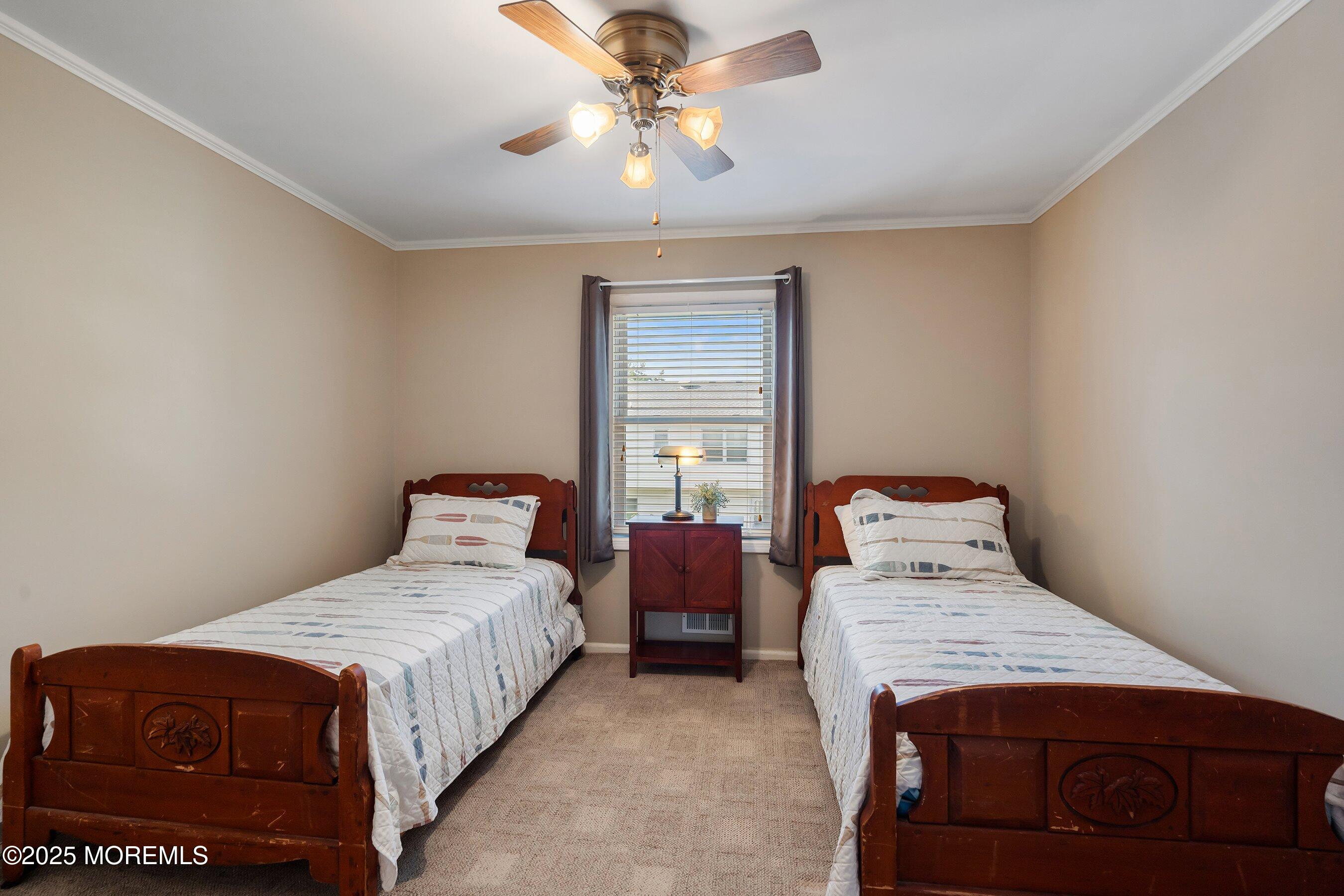 7 Spring Lake Avenue Oceanport, NJ 07757 - Photo 22 of 44 a bedroom with a bed and window