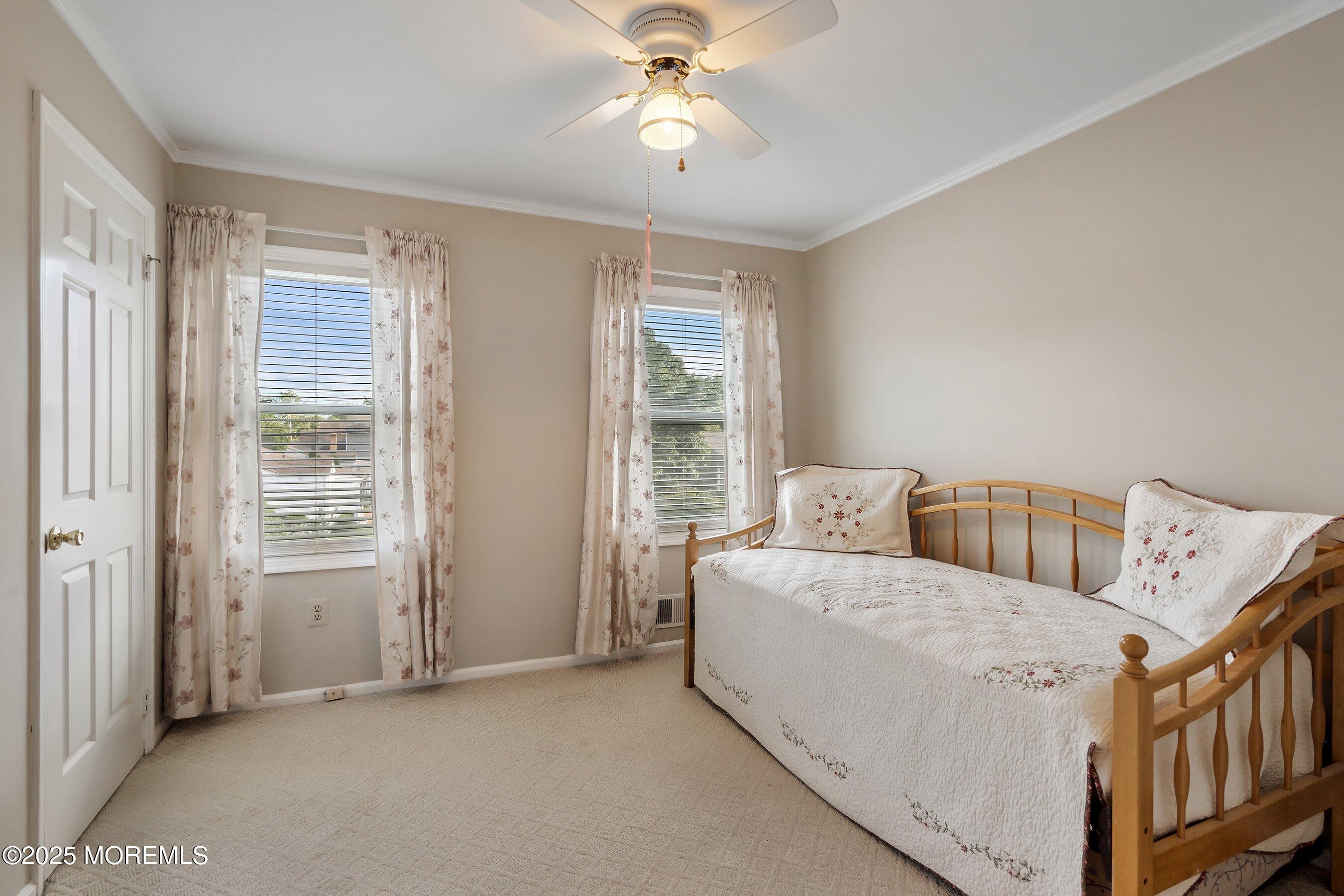 7 Spring Lake Avenue Oceanport, NJ 07757 - Photo 23 of 44 a living room with a bed next to a window