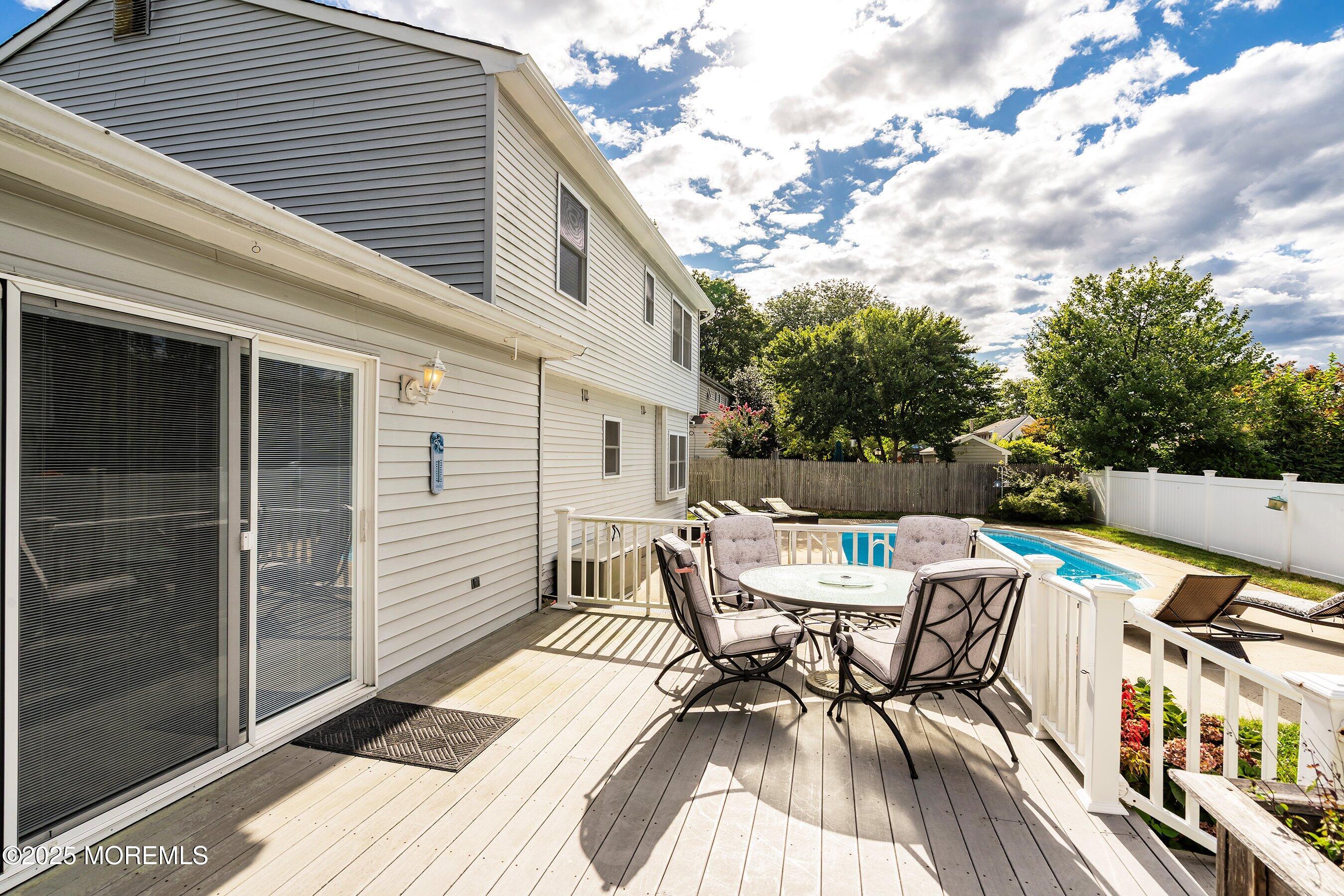 7 Spring Lake Avenue Oceanport, NJ 07757 - Photo 30 of 44 a view of a patio with a table and chairs and potted plants