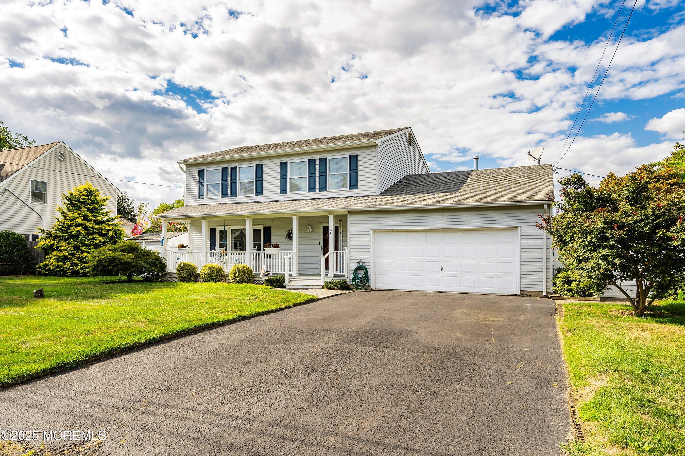 7 Spring Lake Avenue Oceanport, NJ 07757 - Photo 3 of 44 a front view of a house with a garden