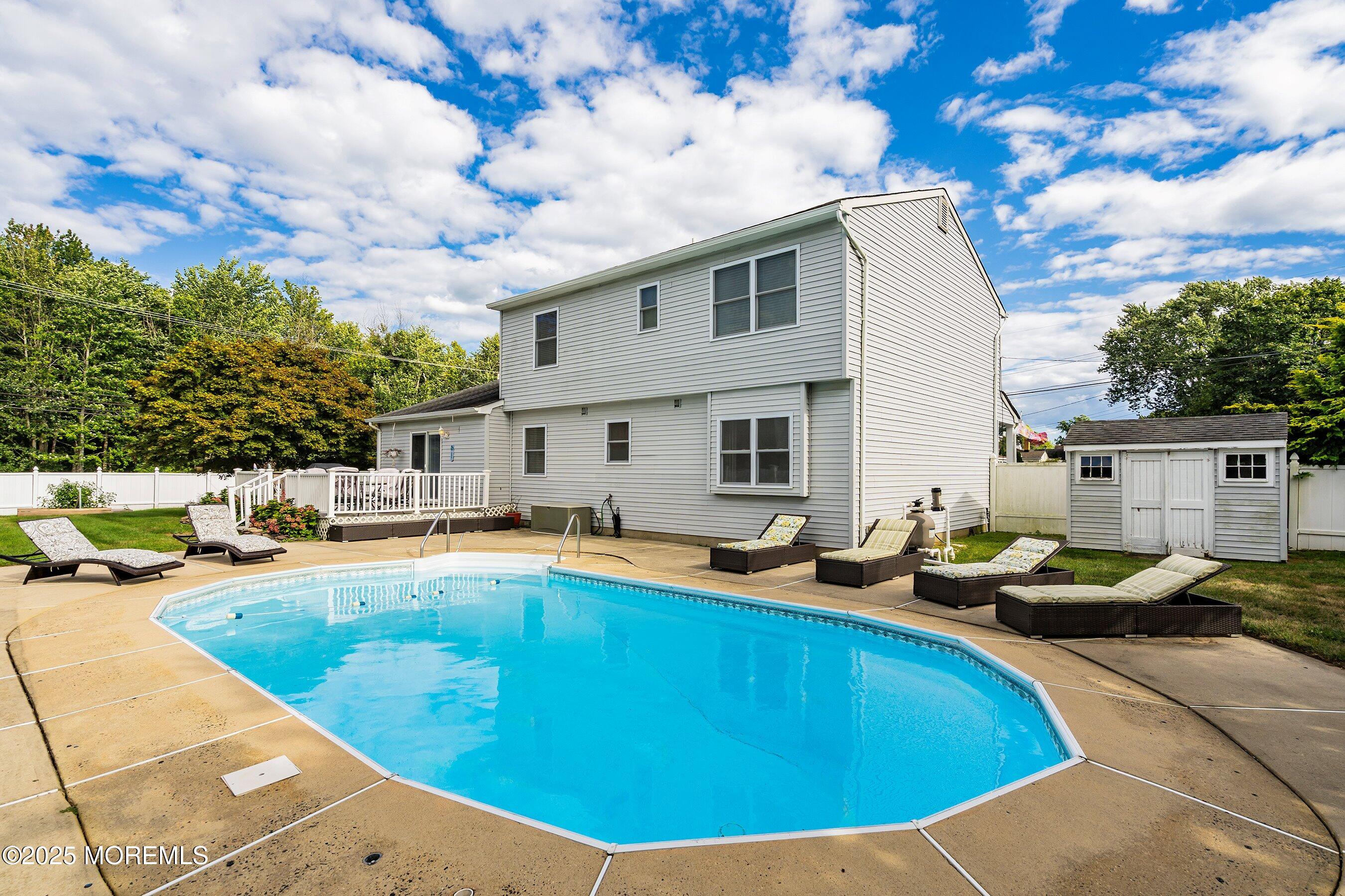 7 Spring Lake Avenue Oceanport, NJ 07757 - Photo 32 of 44 a view of a house with swimming pool and sitting area