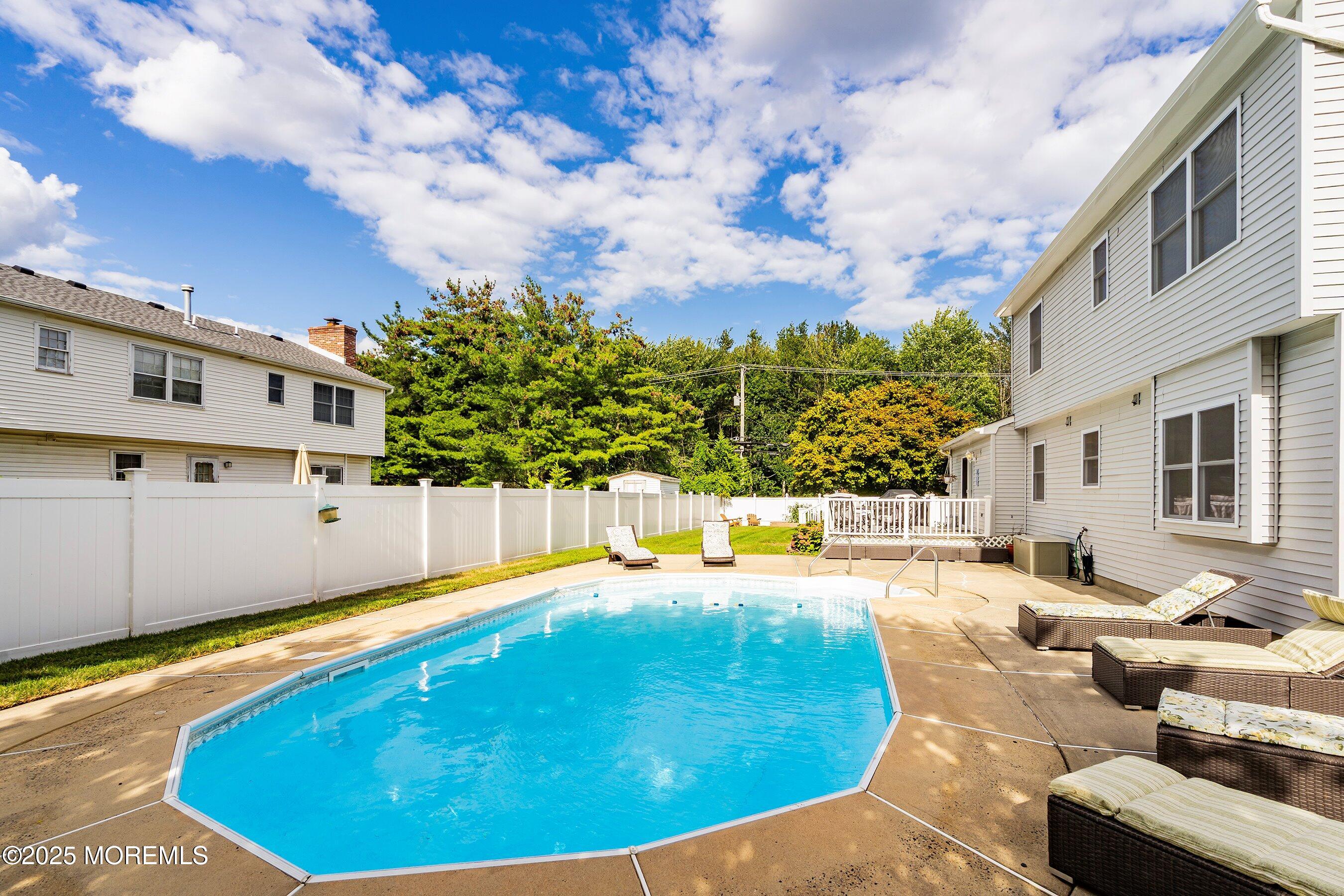7 Spring Lake Avenue Oceanport, NJ 07757 - Photo 34 of 44 a swimming pool with outdoor seating and yard
