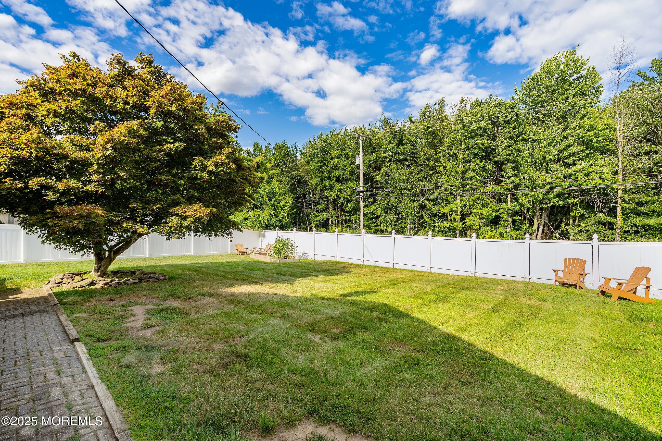 7 Spring Lake Avenue Oceanport, NJ 07757 - Photo 36 of 44 a view of yard with swimming pool and trees