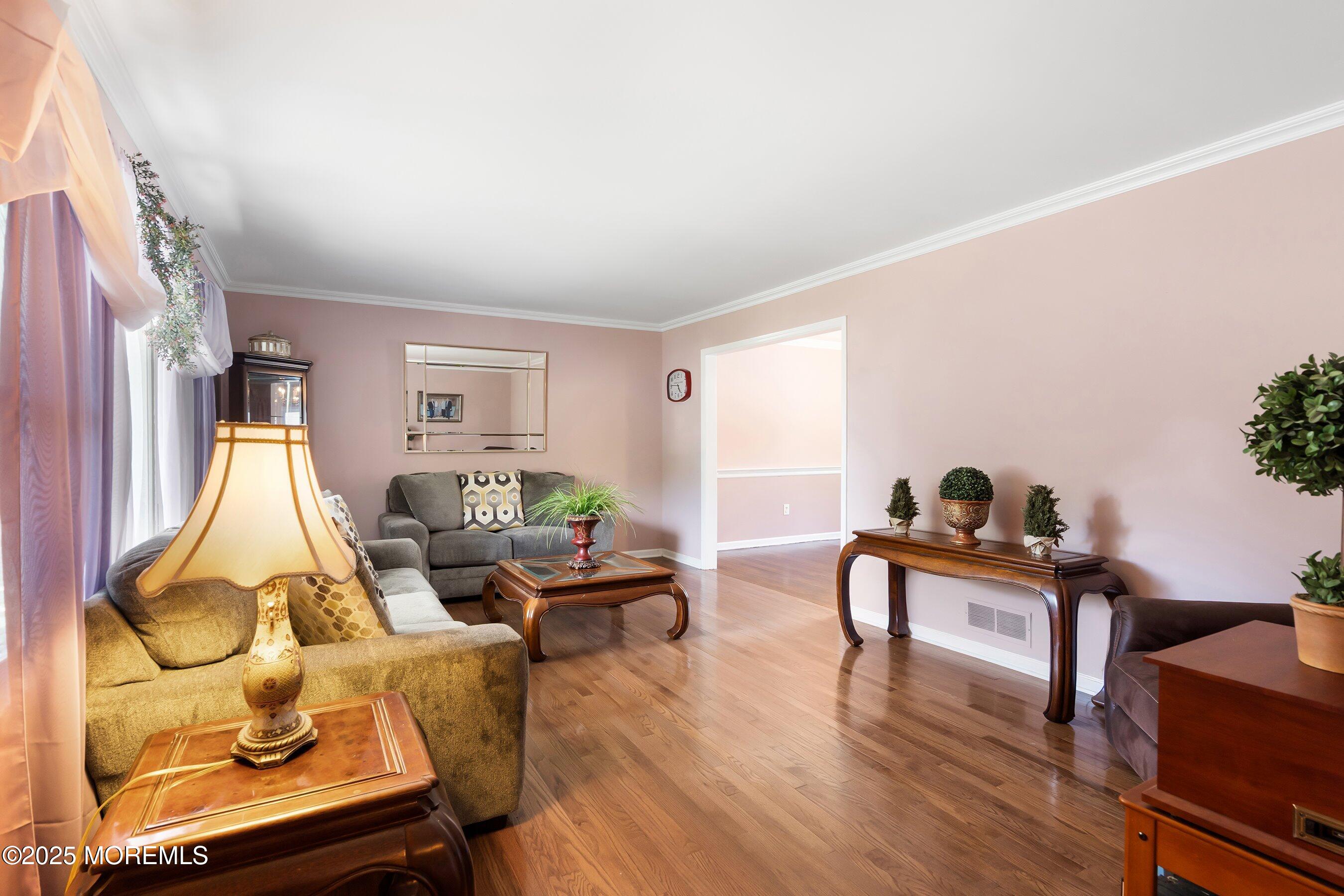 7 Spring Lake Avenue Oceanport, NJ 07757 - Photo 6 of 44 a living room with furniture a rug and a potted plant
