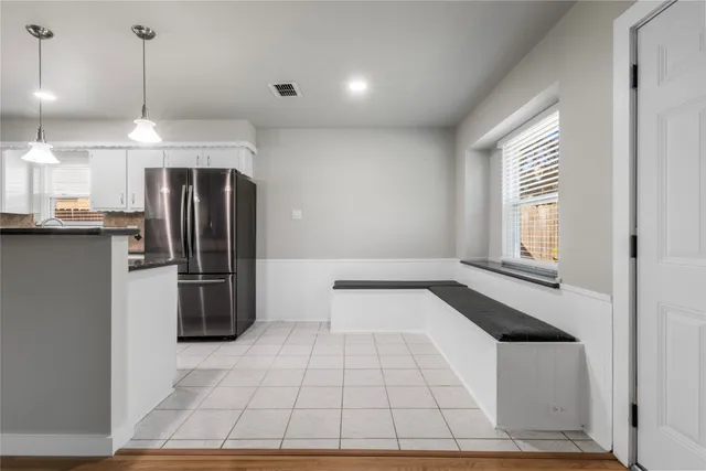 a kitchen with stainless steel appliances a refrigerator and a sink