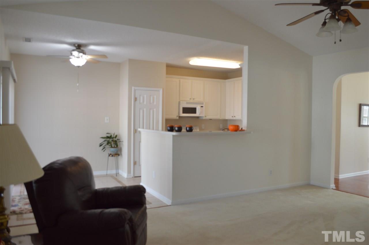 8508 Neuse Garden Drive Raleigh, NC 27616 - Photo 13 of 30 a living room with furniture and a chandelier fan