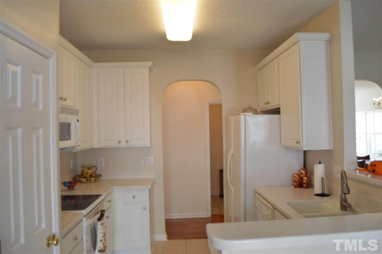 8508 Neuse Garden Drive Raleigh, NC 27616 - Photo 14 of 30 a kitchen with stainless steel appliances granite countertop a refrigerator and a sink