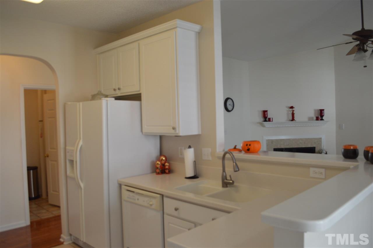 8508 Neuse Garden Drive Raleigh, NC 27616 - Photo 16 of 30 a room with stainless steel appliances a sink a refrigerator and cabinets