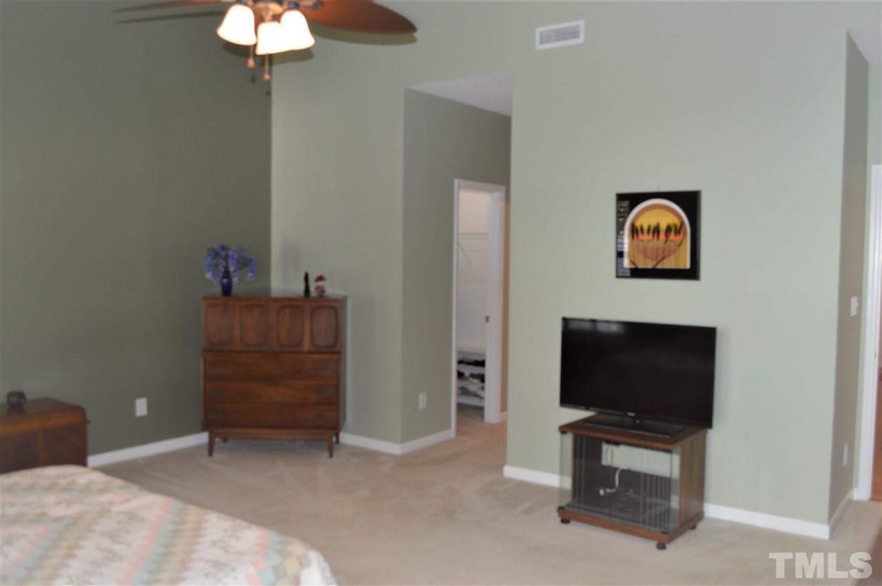 8508 Neuse Garden Drive Raleigh, NC 27616 - Photo 18 of 30 a living room with furniture and a flat screen tv
