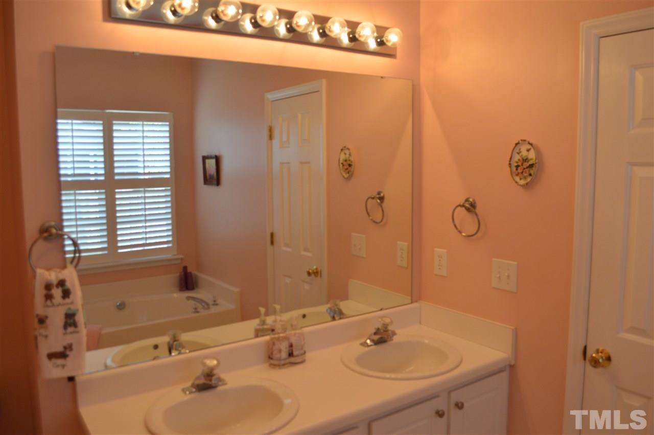 8508 Neuse Garden Drive Raleigh, NC 27616 - Photo 21 of 30 a bathroom with a sink and a mirror