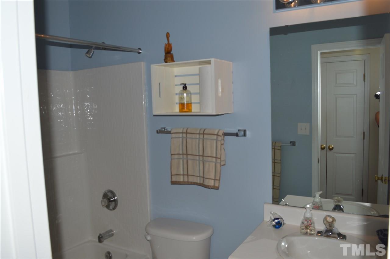 8508 Neuse Garden Drive Raleigh, NC 27616 - Photo 23 of 30 a bathroom with a sink and a mirror