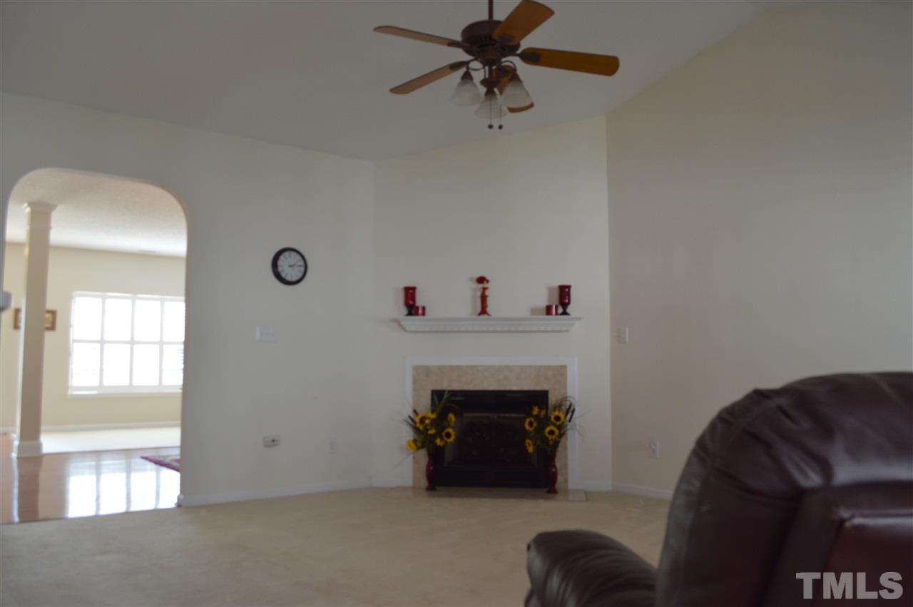 8508 Neuse Garden Drive Raleigh, NC 27616 - Photo 10 of 30 a living room with furniture and a fireplace