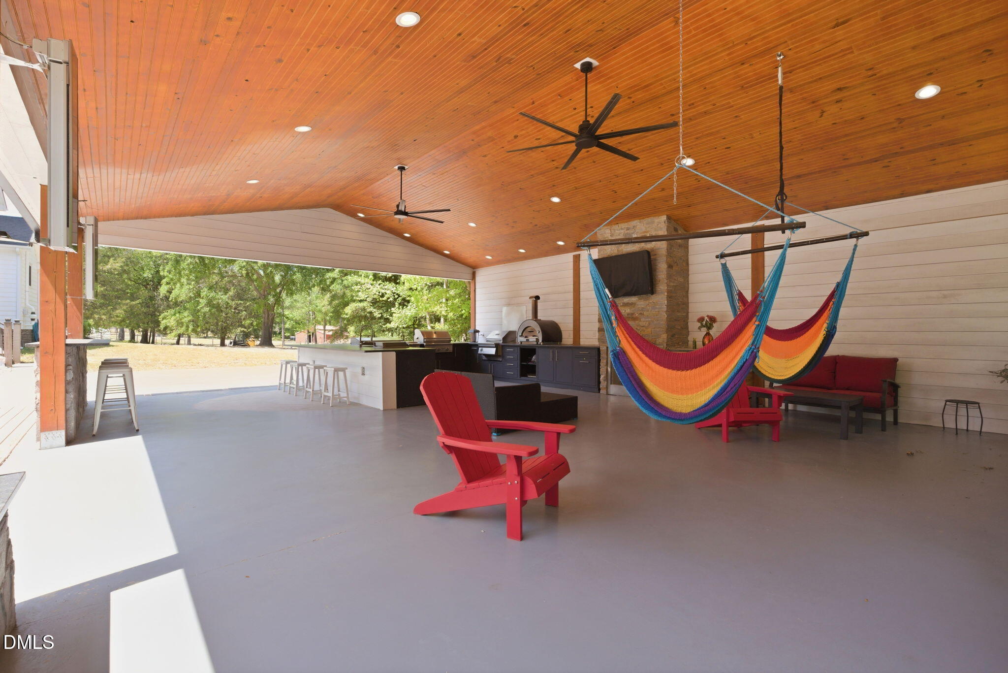 5416 Pulley Town Road Zebulon, NC 27597 - Photo 38 of 74 a backyard of a house with swimming pool and outdoor seating