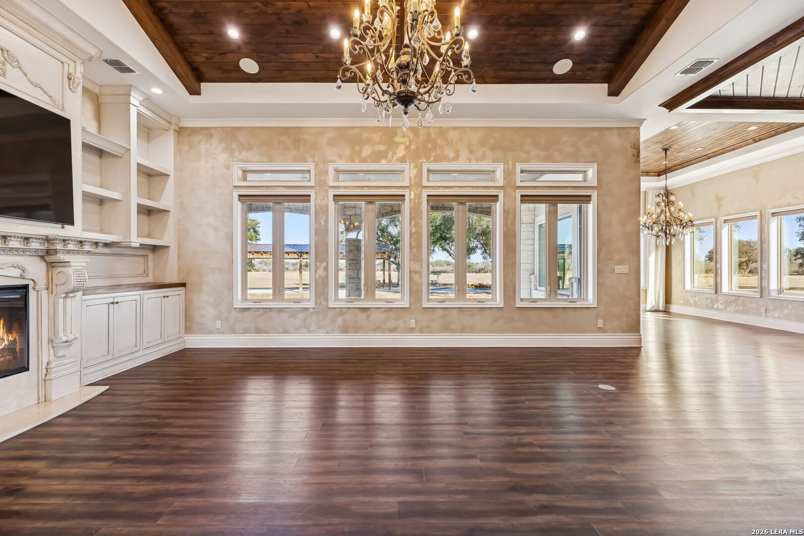 3128 Old St Marys Road Beeville, TX 78102 - Photo 12 of 50 a view of an empty room with wooden floor and a kitchen