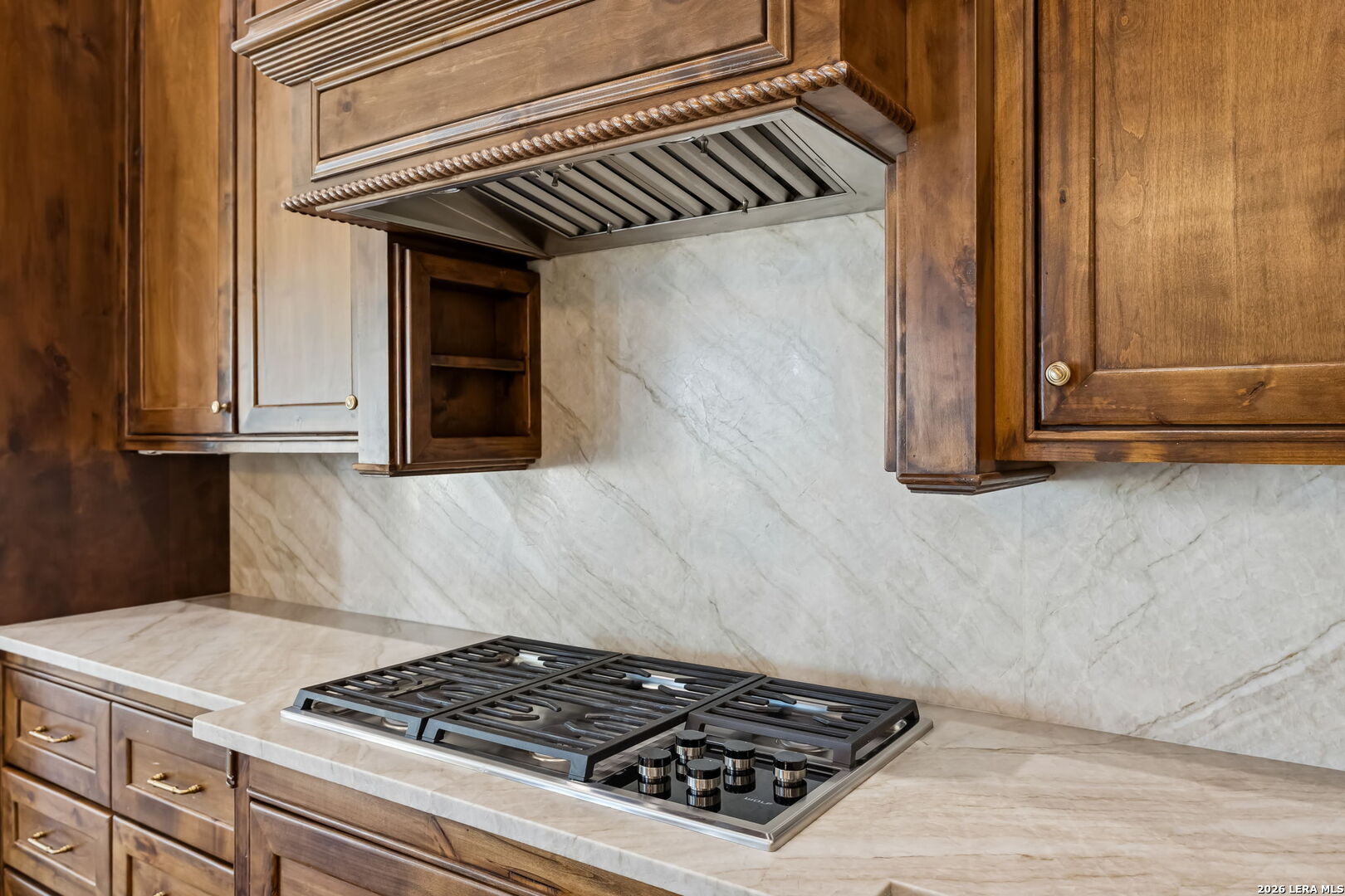 3128 Old St Marys Road Beeville, TX 78102 - Photo 18 of 50 a kitchen with stainless steel appliances granite countertop a stove and a microwave oven
