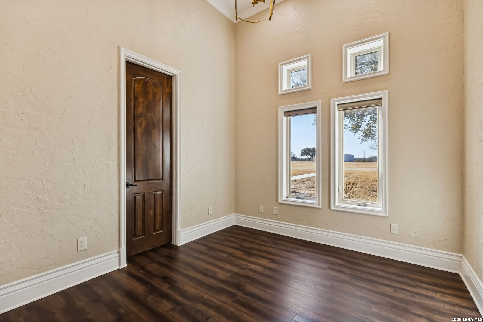 3128 Old St Marys Road Beeville, TX 78102 - Photo 40 of 50 an empty room with wooden floor and windows