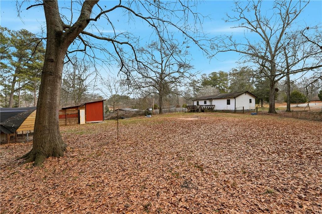 5685 Ashland Farm Road Oxford, GA 30054 - Photo 22 of 25 a view of yard with tree in the background