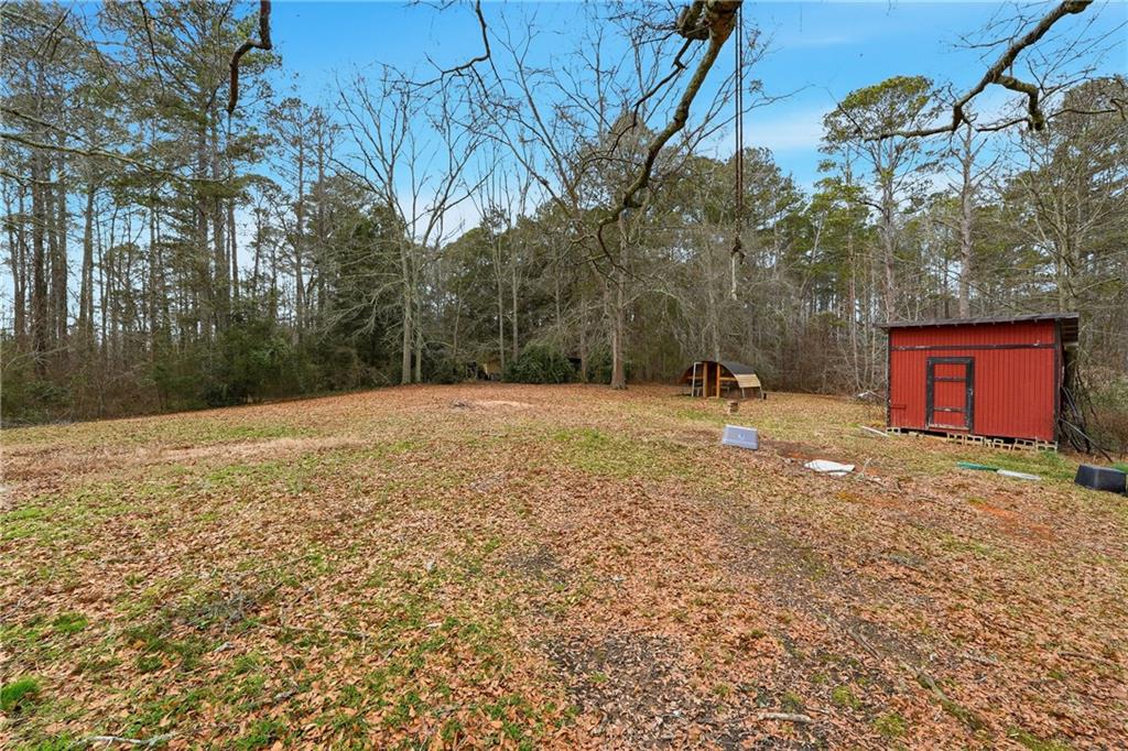 5685 Ashland Farm Road Oxford, GA 30054 - Photo 25 of 25 a backyard of a house with lots of green space