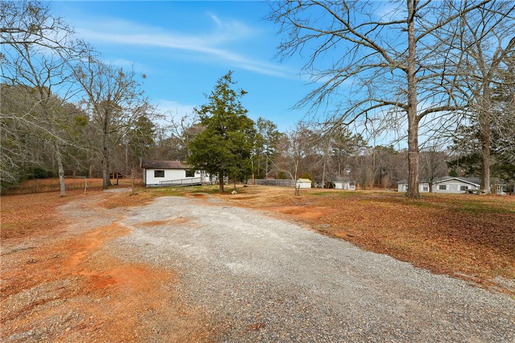 5685 Ashland Farm Road Oxford, GA 30054 - Photo 7 of 25 a view of road with with trees