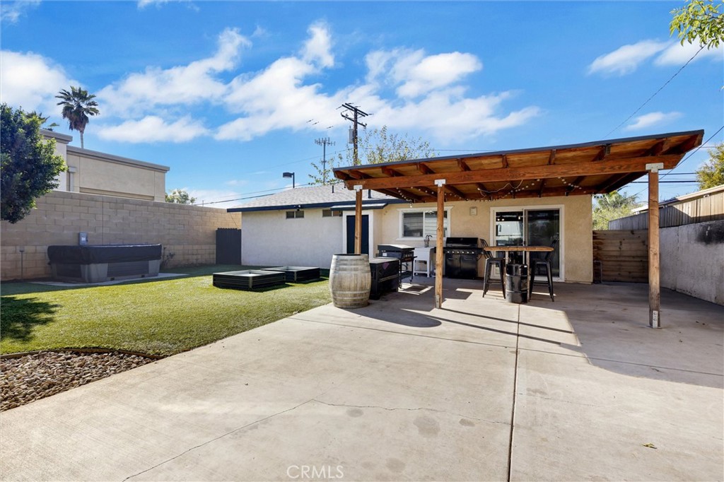 15936 Dauchy Avenue Riverside, CA 92508 - Photo 22 of 25 a view of a house with backyard porch and sitting area