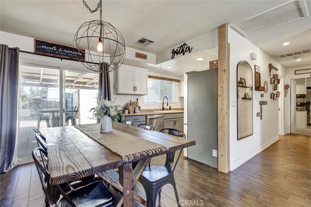15936 Dauchy Avenue Riverside, CA 92508 - Photo 8 of 25 a view of a dining room with furniture window and wooden floor