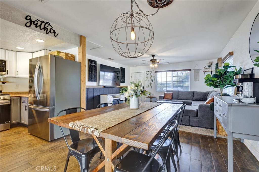 15936 Dauchy Avenue Riverside, CA 92508 - Photo 9 of 25 a view of a dining room with furniture window and wooden floor