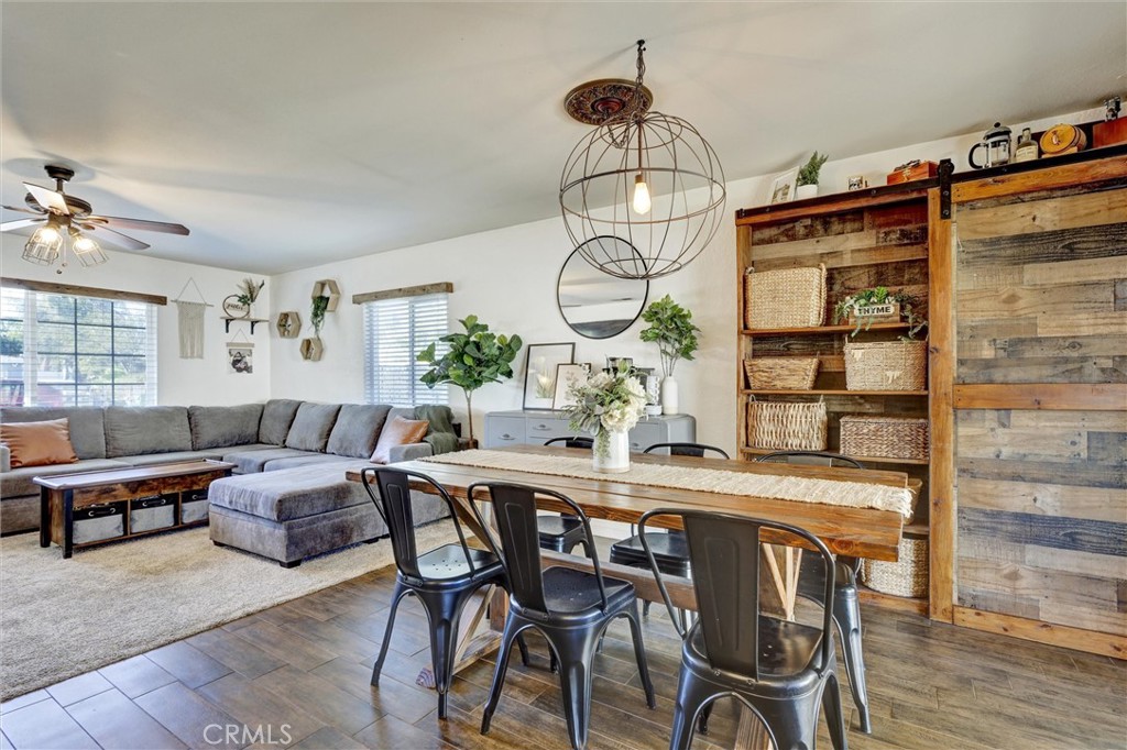 15936 Dauchy Avenue Riverside, CA 92508 - Photo 10 of 25 a view of a dining room with furniture window and wooden floor