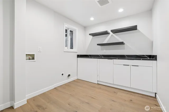 a bedroom with a large bed and furniture