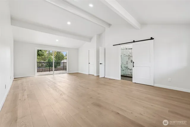 a bedroom with a large bed and furniture