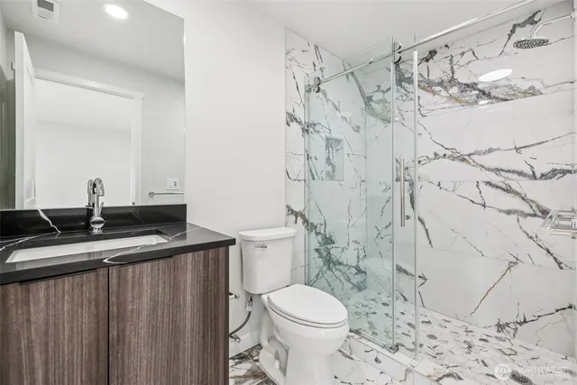 a bathroom with a bathtub and shower