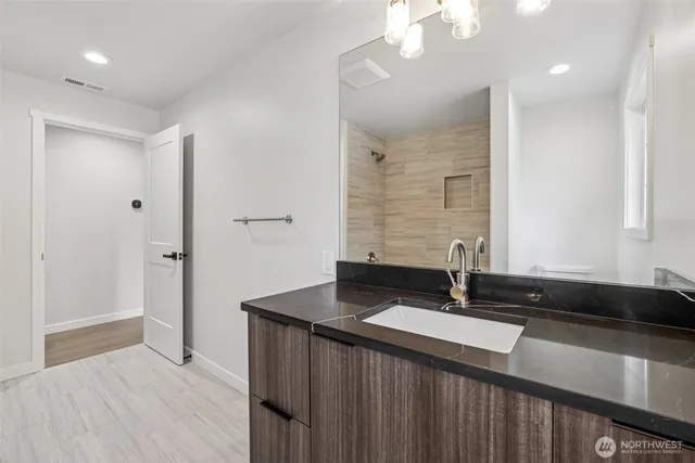 a bathroom with a tub and shower