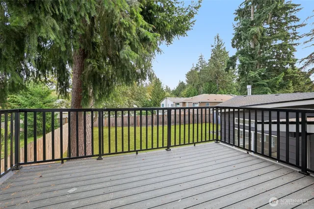 a view of a house with backyard and porch