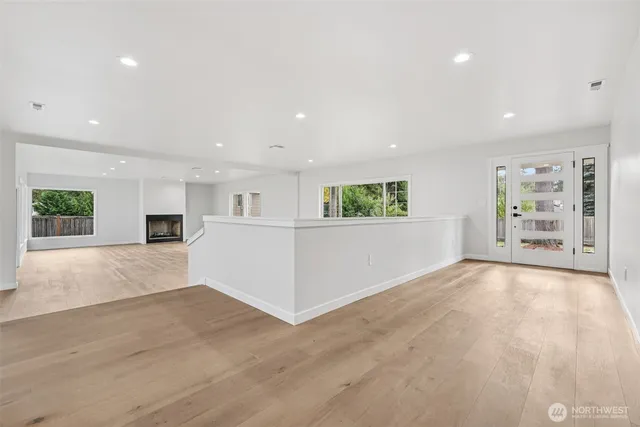 a view of a livingroom with an empty space and a window