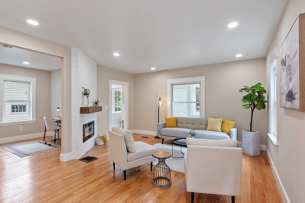12 Romola Road Worcester, MA 01609 - Photo 11 of 33 a living room with furniture wooden floor and a potted plant
