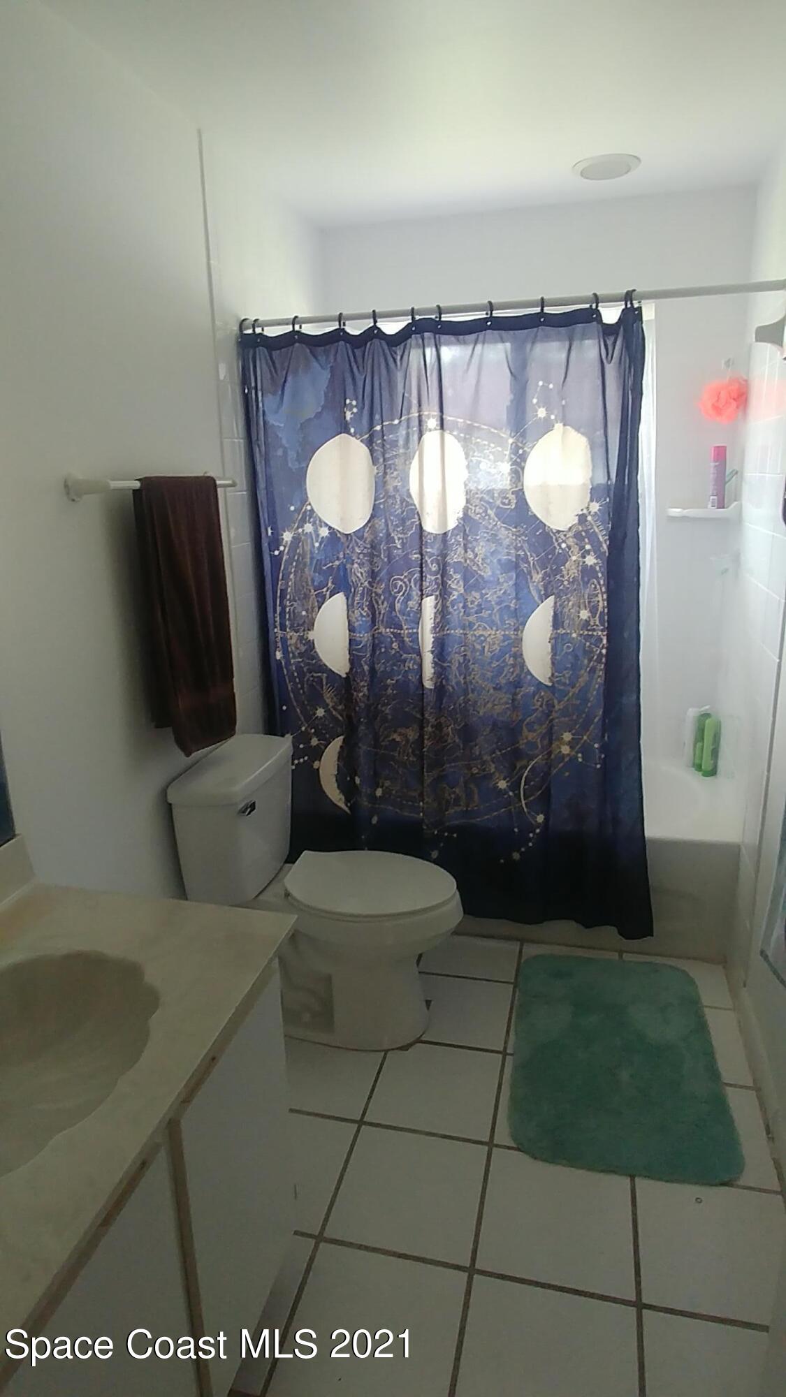 604 Ridge Club Drive, Unit 96 Melbourne, FL 32934 - Photo 12 of 17 a bathroom with a sink and a mirror