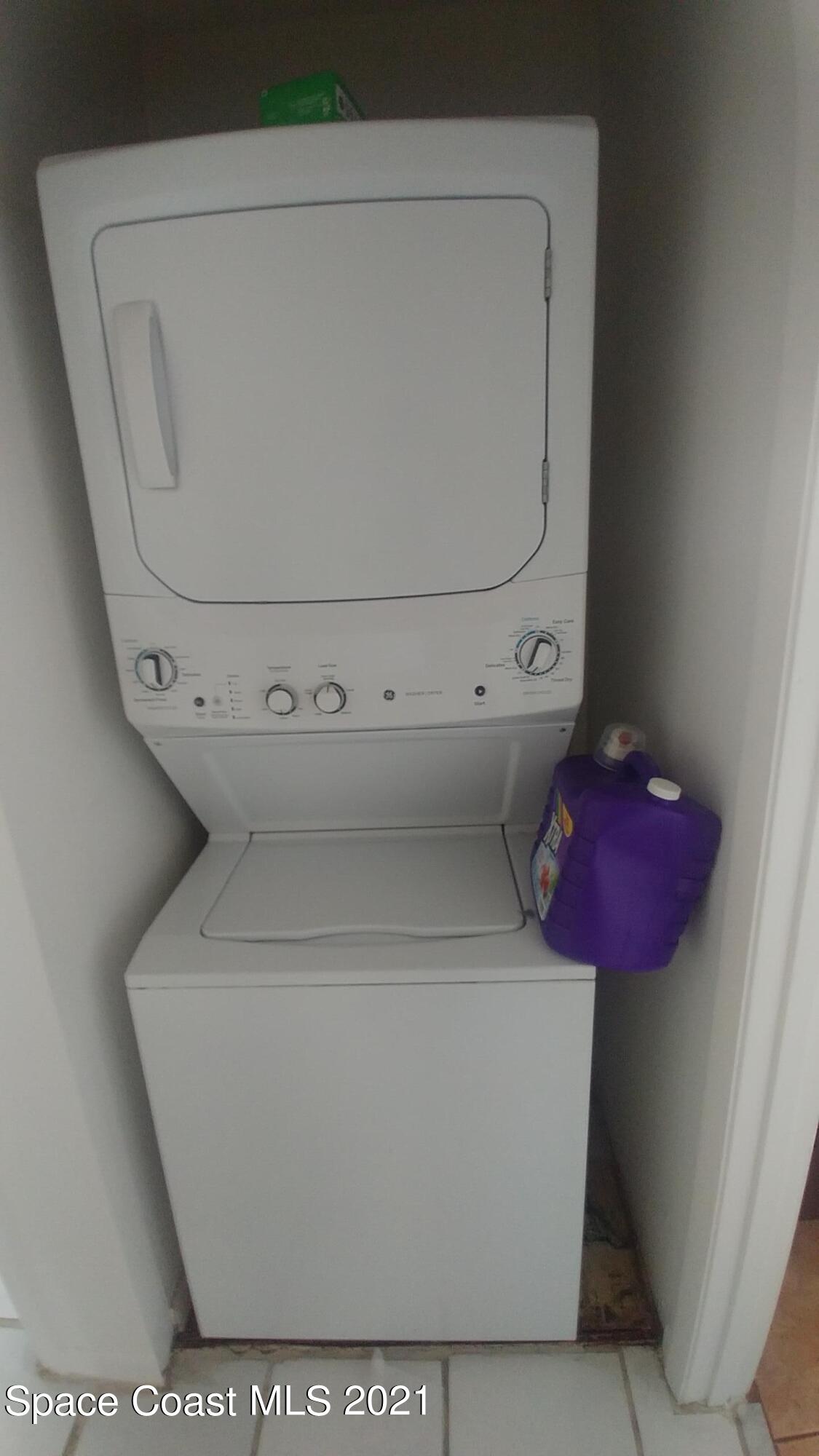 604 Ridge Club Drive, Unit 96 Melbourne, FL 32934 - Photo 17 of 17 a utility room with a toilet