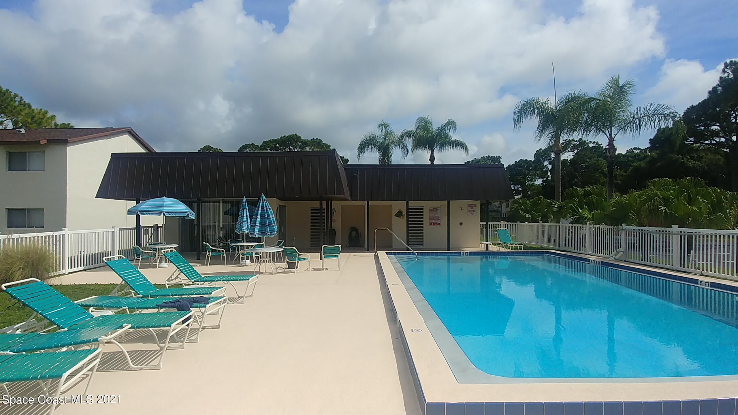 604 Ridge Club Drive, Unit 96 Melbourne, FL 32934 - Photo 4 of 17 a view of a patio with swimming pool