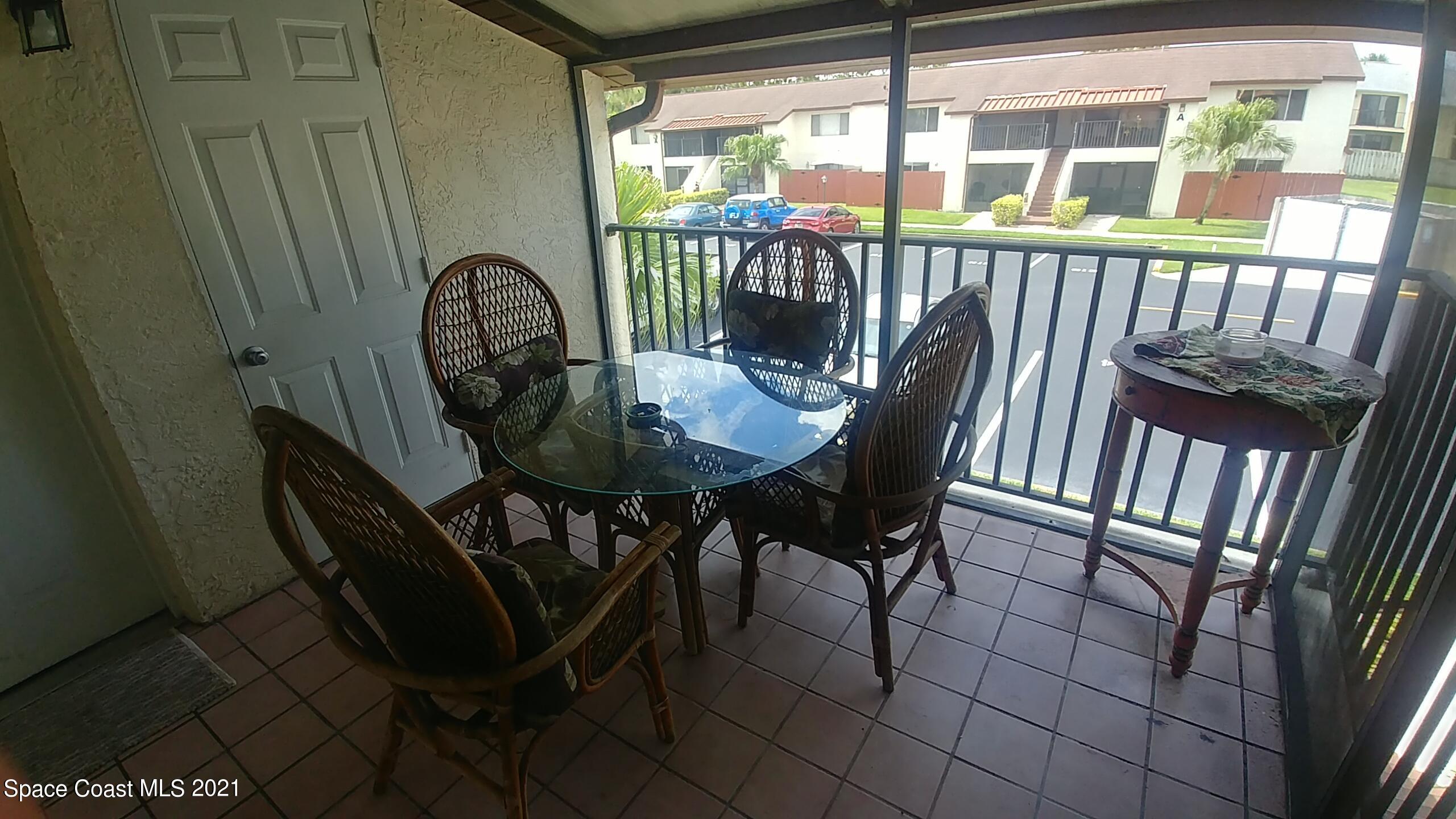 604 Ridge Club Drive, Unit 96 Melbourne, FL 32934 - Photo 5 of 17 a view of a balcony with furniture