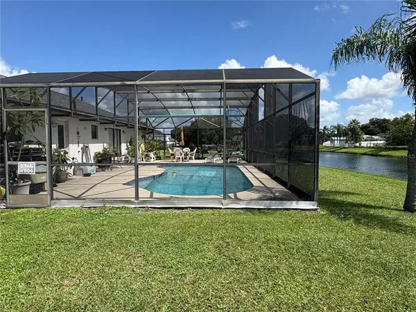 a view of a swimming pool with a patio
